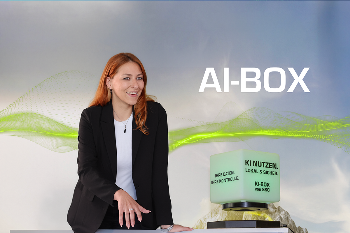 A woman next to the AI Box.